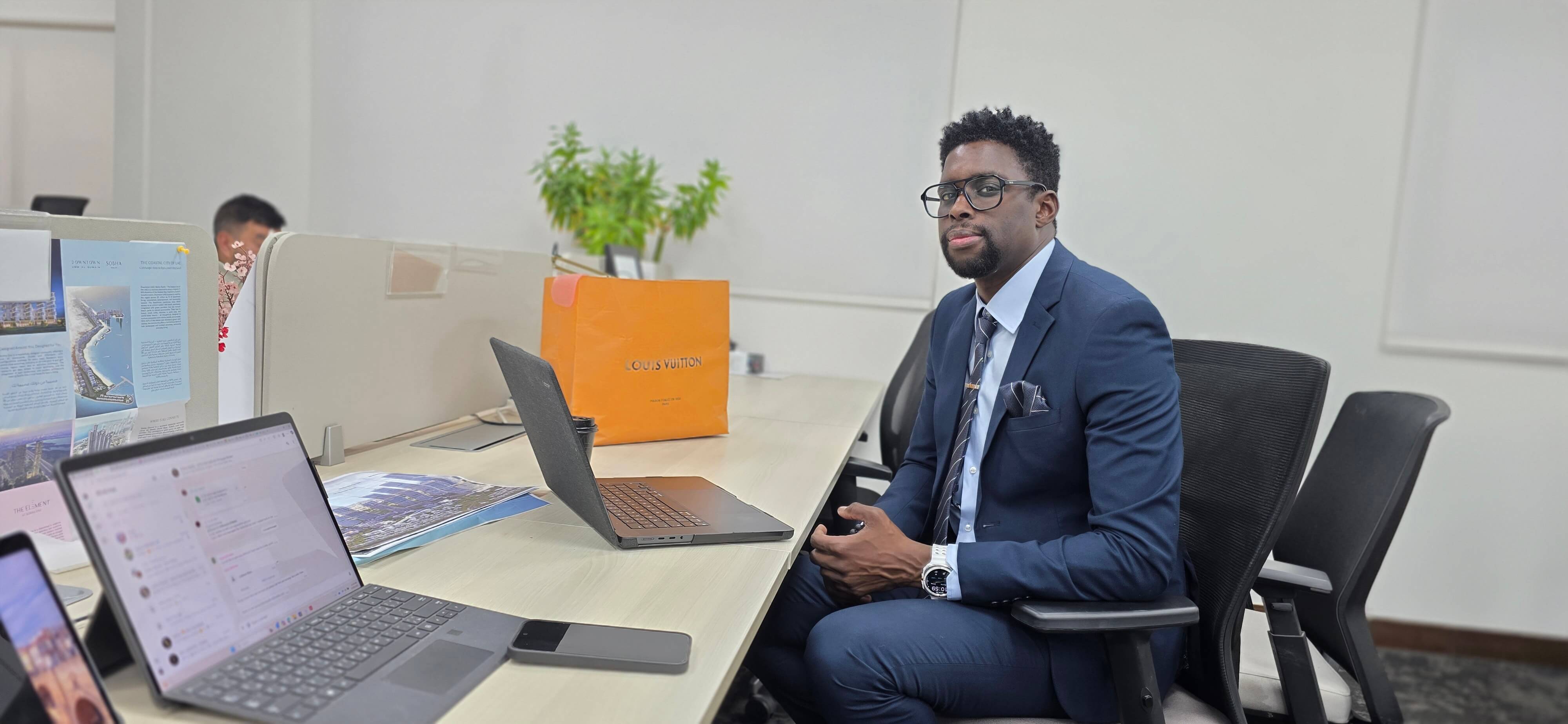 Daou Daly working in a Dubai real estate office
